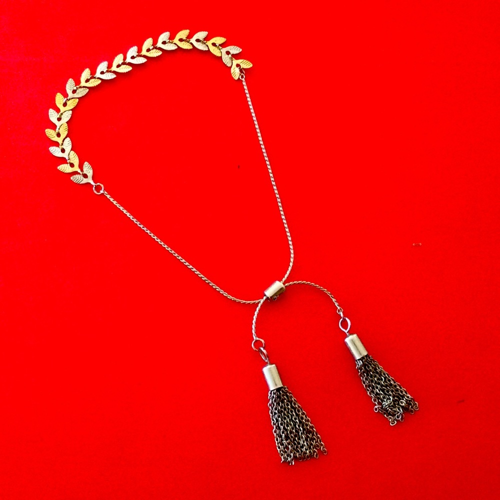 Silver and gold tone leave adjustable bracelet